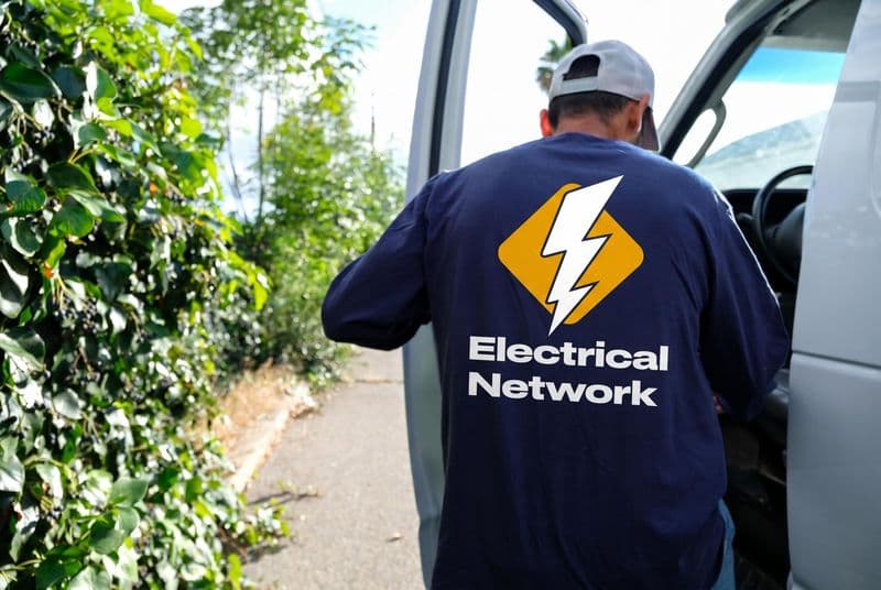 Cesar wearing Electrical Network Inc. branded uniform