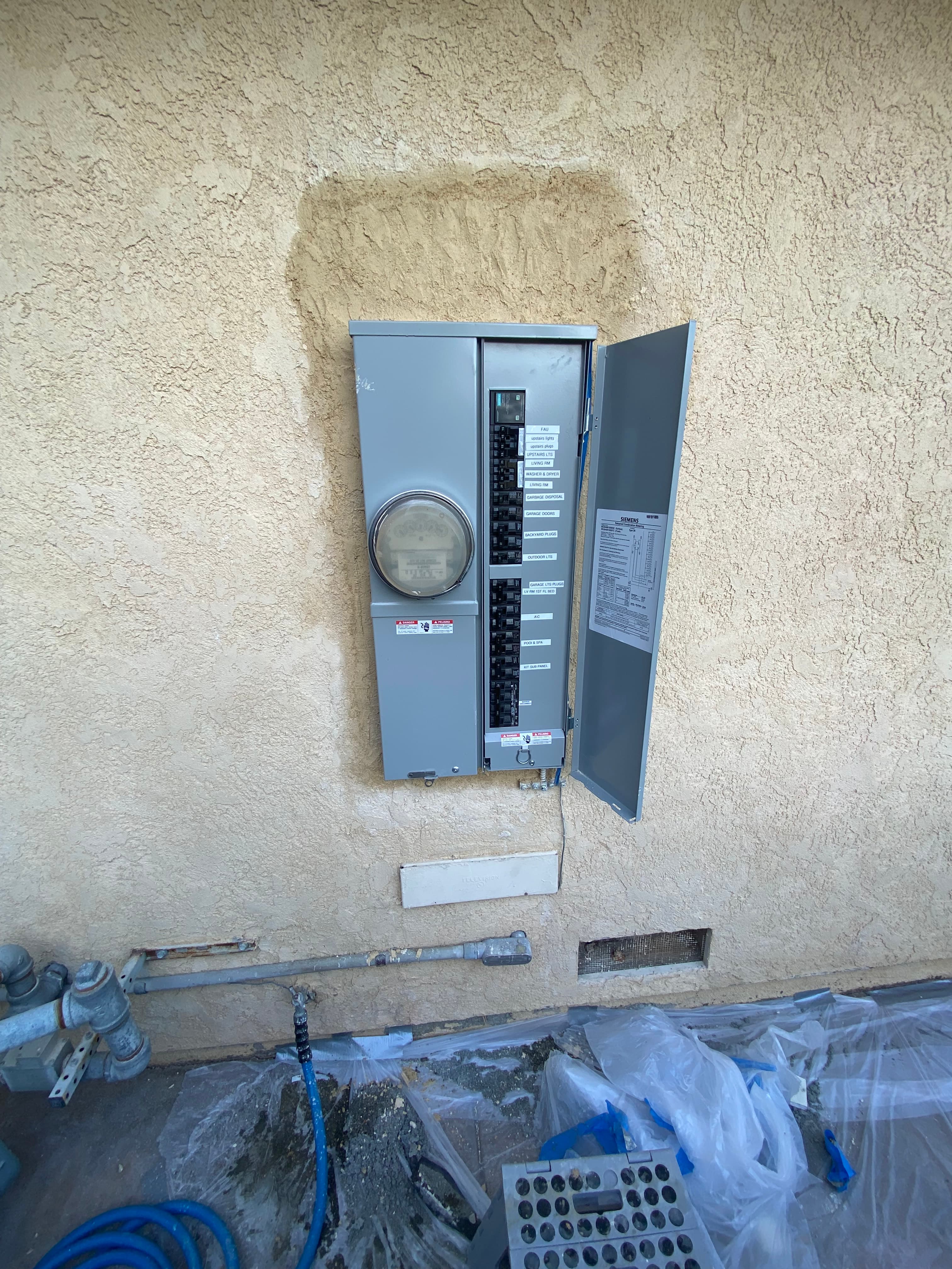 Open exterior breaker panel during a service upgrade