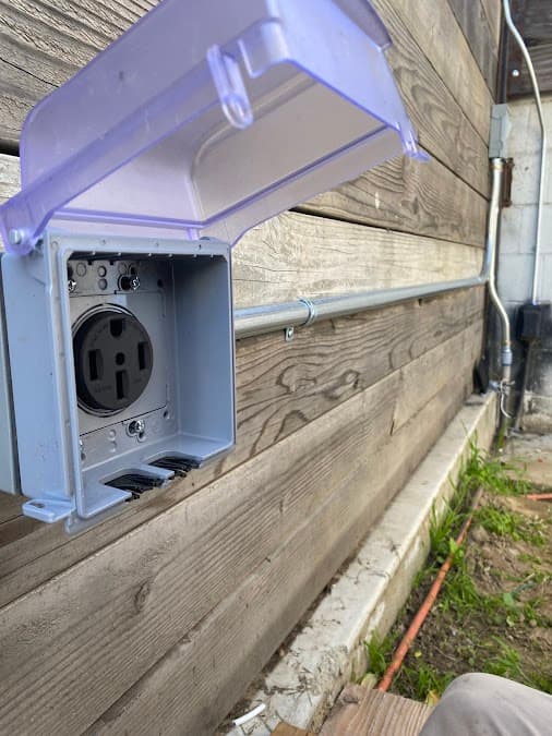 Weatherproof NEMA 14-50 outlet installed for EV charging